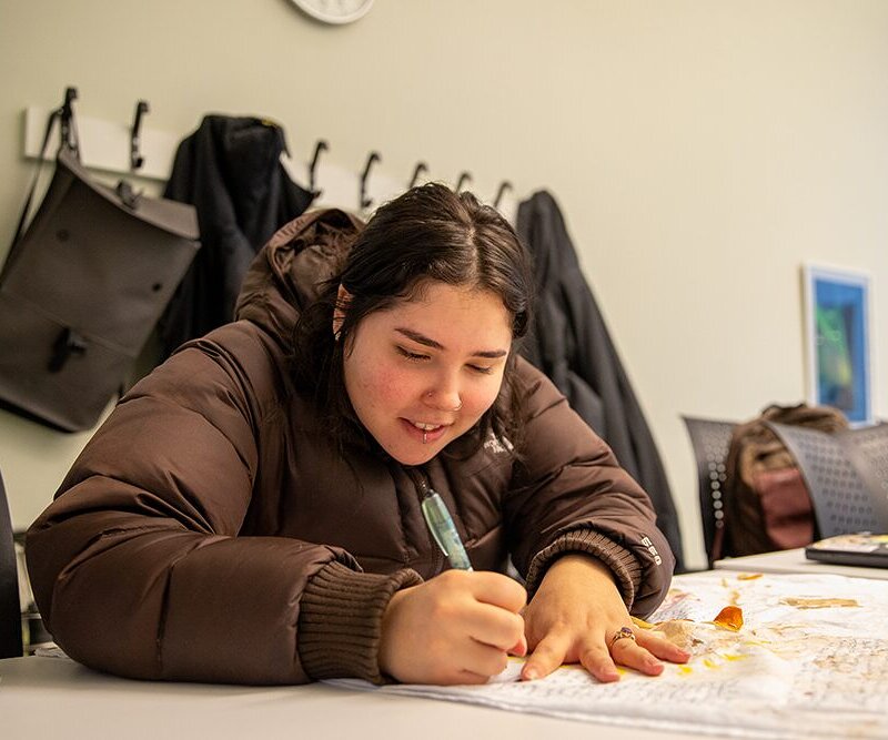 Betsy working on her final personal art project for class.